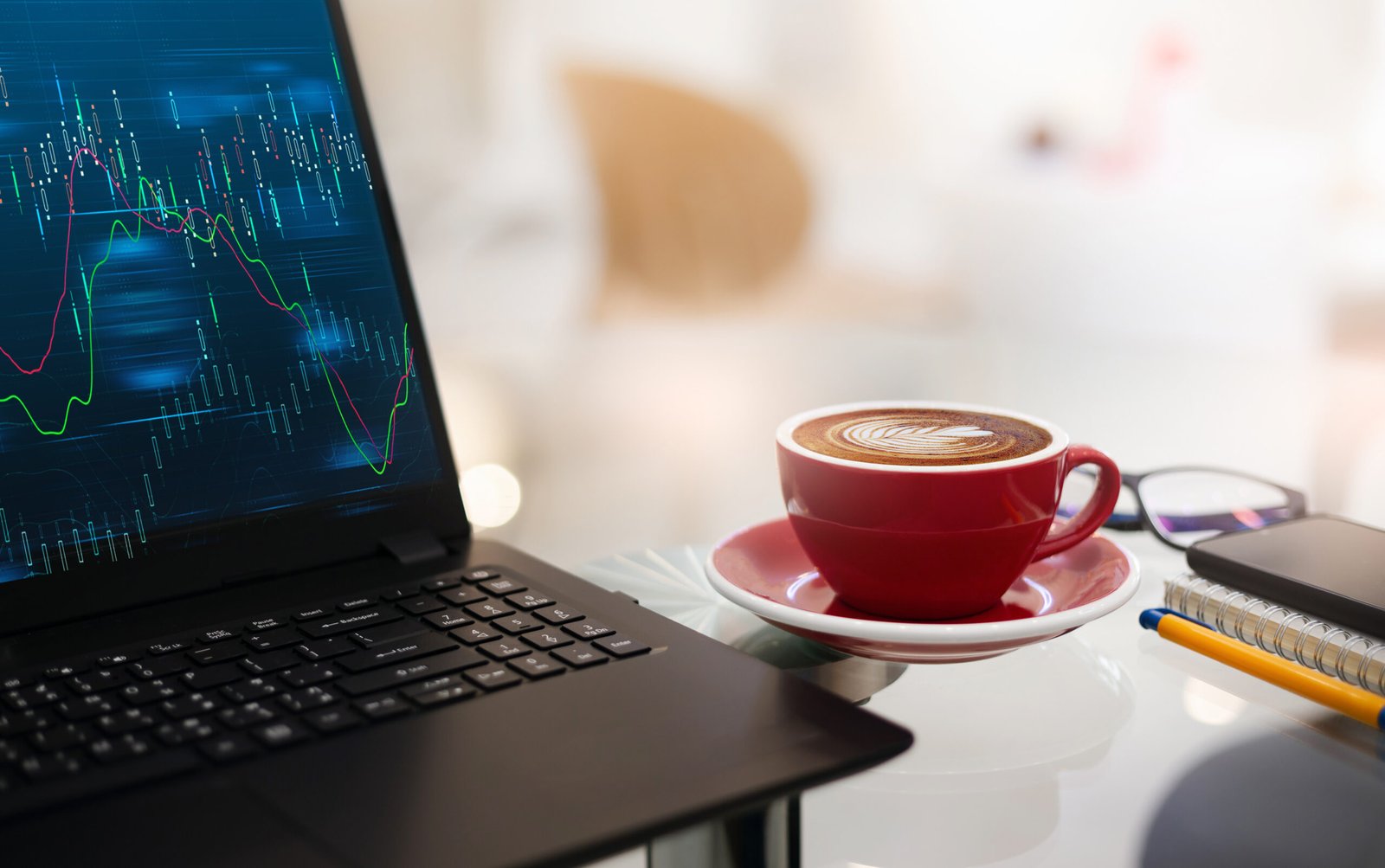 Pre-market research checklist in action: trader checking charts with morning coffee