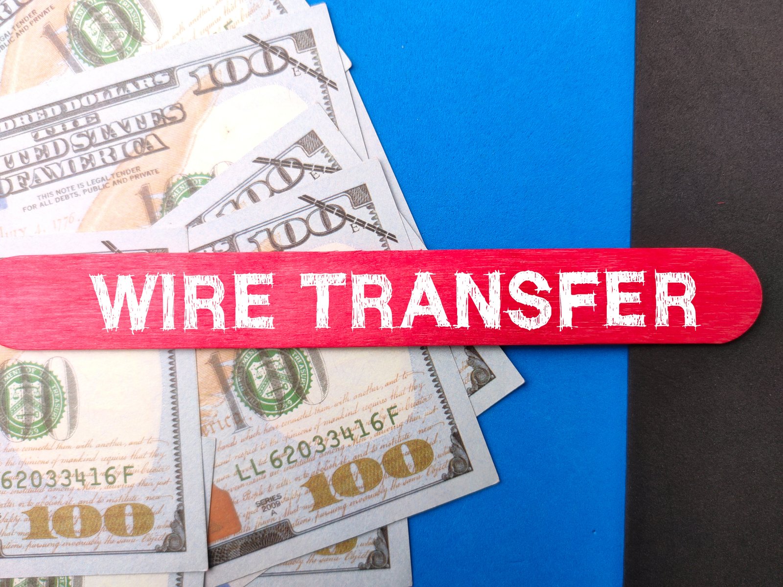 Bank wire transfer banknotes representing the cost of international transfers